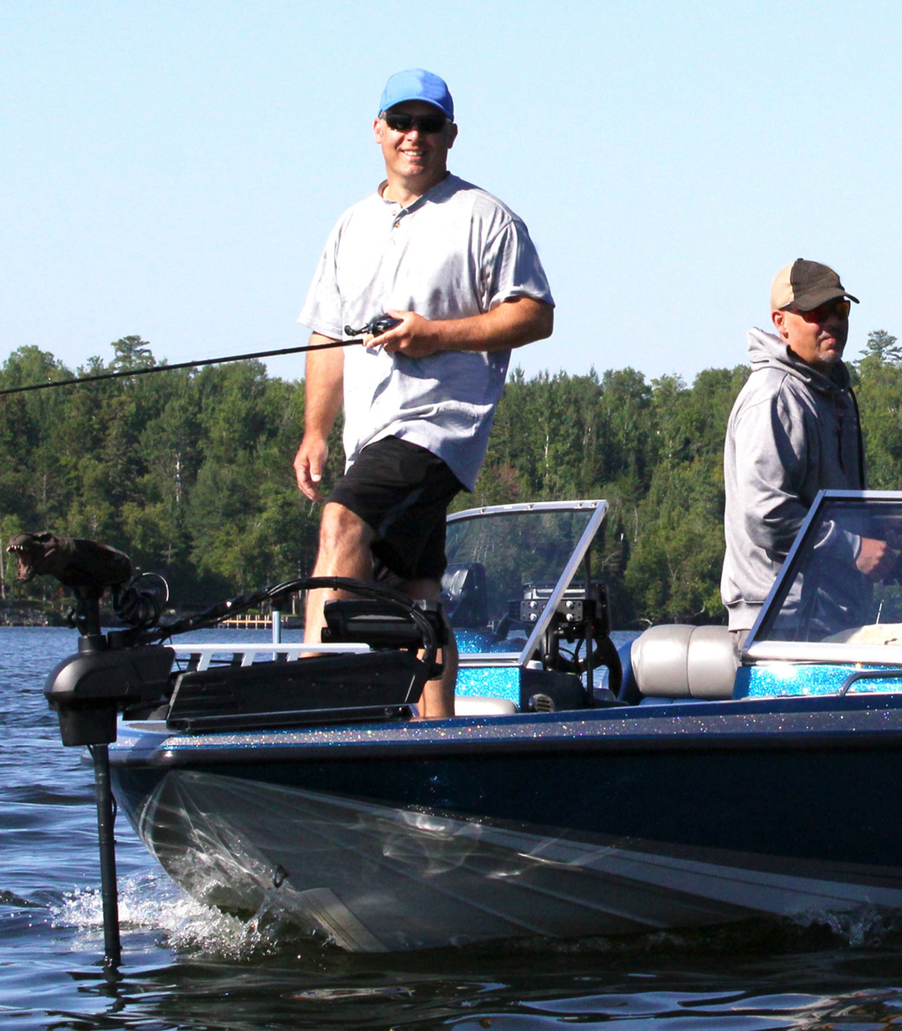 a group of people riding on the back of a boat