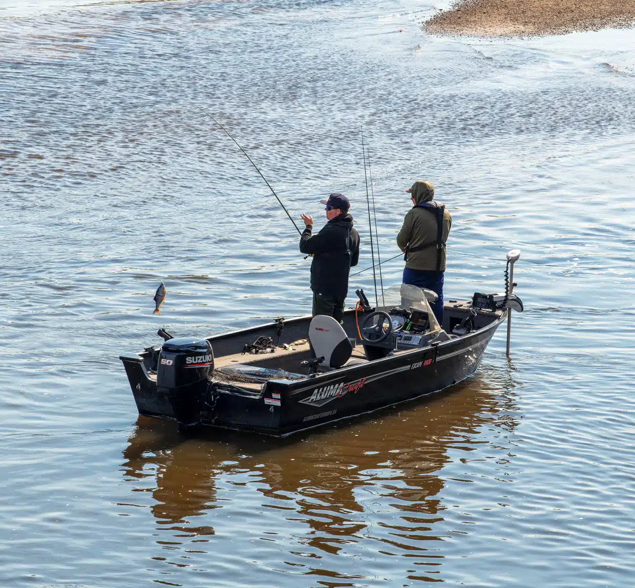 a man in a boat on a body of water